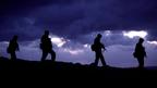 Soldiers walking in silhouette (Copyright: Getty Images)